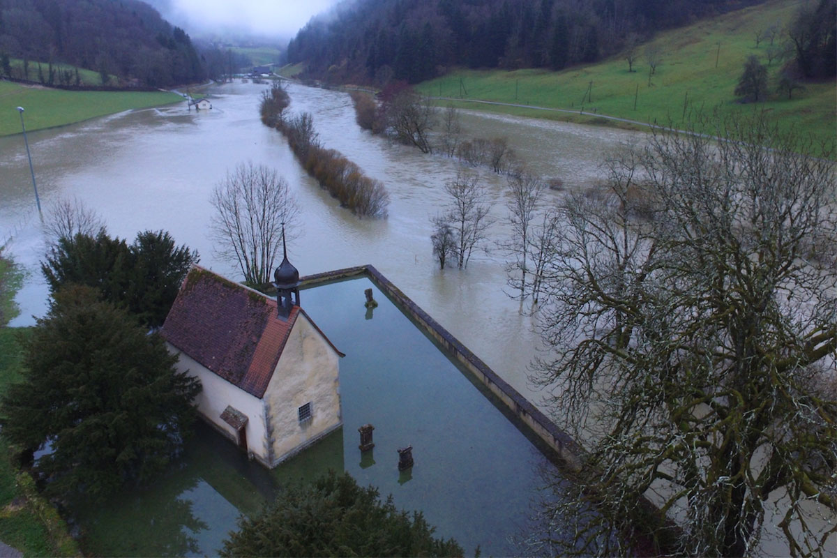 River flood reaching a church